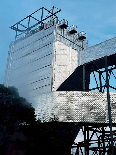Insulated ESP casing tower with roof access frame and outlet ducting